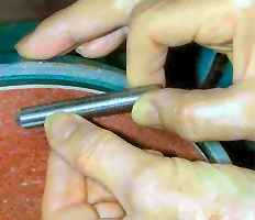 Beveling a dowell pin by hand