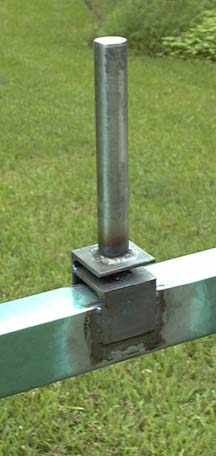 Pivot assembly welded in place