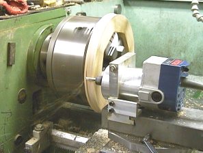 Router mounted in a metal lathe